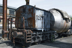 Wolfgang Weiser - Vintage locomotive at German industrial park showcasing rusty, old technology.