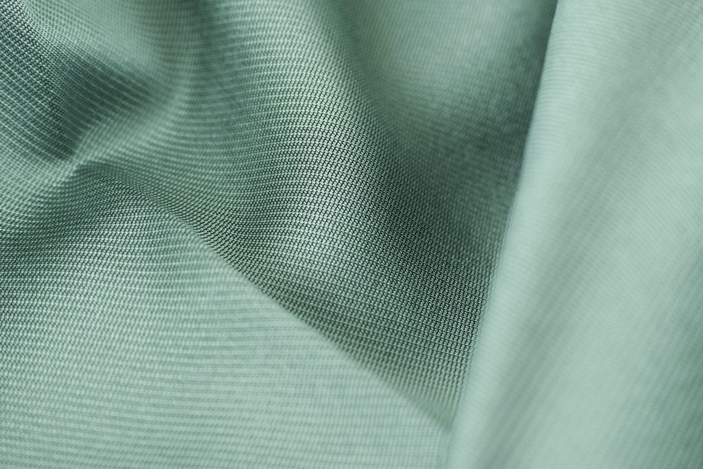 Engin Akyurt - Detailed close-up shot of smooth green silk fabric texture showcasing softness and elegance.
