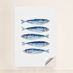 Blue Fin Row artwork features five blue and silver fish illustrated in a row on a white textured background, shown in a unframed style.