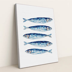 Blue Fin Row artwork features five blue and silver fish illustrated in a row on a white textured background, displayed in a silver frame.