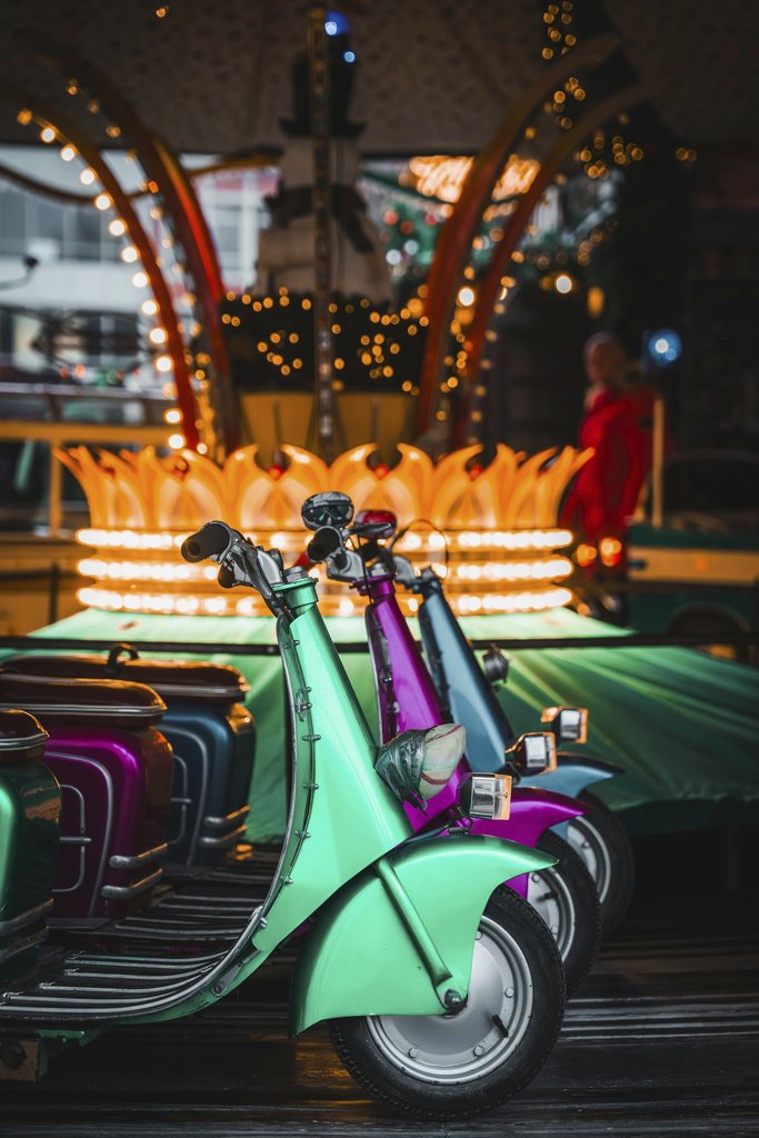 Christiyana - Vibrant Vespas parked at Lüneburg Christmas market creating festive ambiance.
