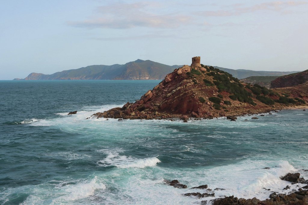 Efrem Efre - Beautiful seascape of Alghero coastline with waves crashing against rocky cliffs in Sardinia, Italy.