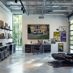 Modern office with a Porsche 918 Spyder at European Estate wall art, showcasing sleek car design amid stylish decor.