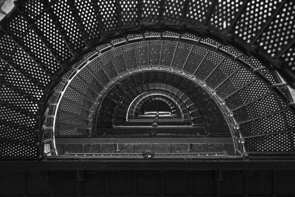 Mark Stebnicki - Intricate spiral staircase in black and white, showcasing architectural beauty.