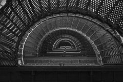 Mark Stebnicki - Intricate spiral staircase in black and white, showcasing architectural beauty.