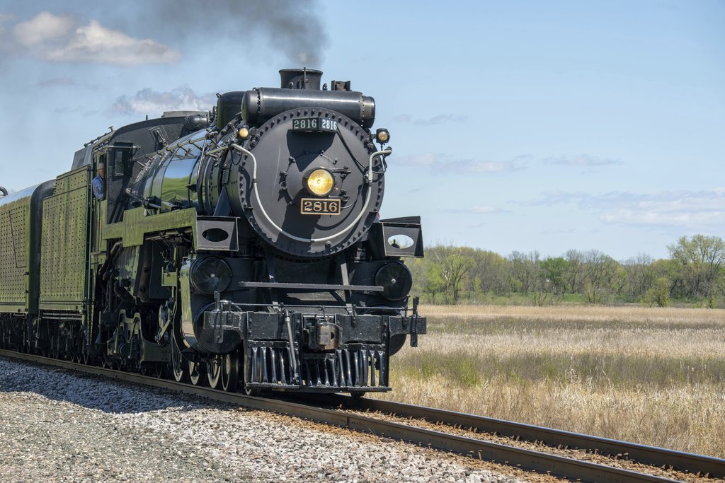 Tom Fisk - A classic steam locomotive traveling through the scenic rural fields of Kellogg, MN, USA.