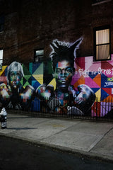 Chalo Gallardo - A large mural on the side of a building photo