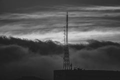 Anderson Santos - Black and white image of an antenna tower against a dramatic cloudscape in São Paulo, Brazil.