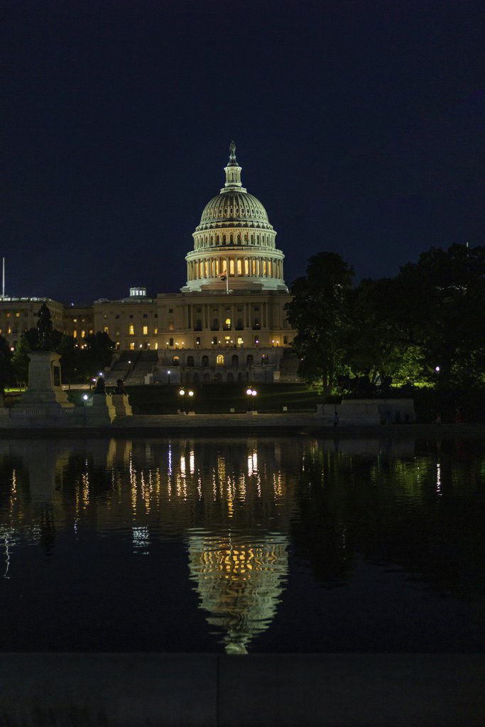 Hugo Magalhaes - Stunning night view of the US Capitol reflected in nearby water, Washington D.C.