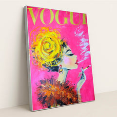 This artwork shows a glamorous painted woman with a yellow updo, feathered collar, and cigarette on a vivid pink Vogue magazine cover, in a silver frame.
