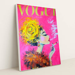 This artwork shows a glamorous painted woman with a yellow updo, feathered collar, and cigarette on a vivid pink Vogue magazine cover, in a white frame.
