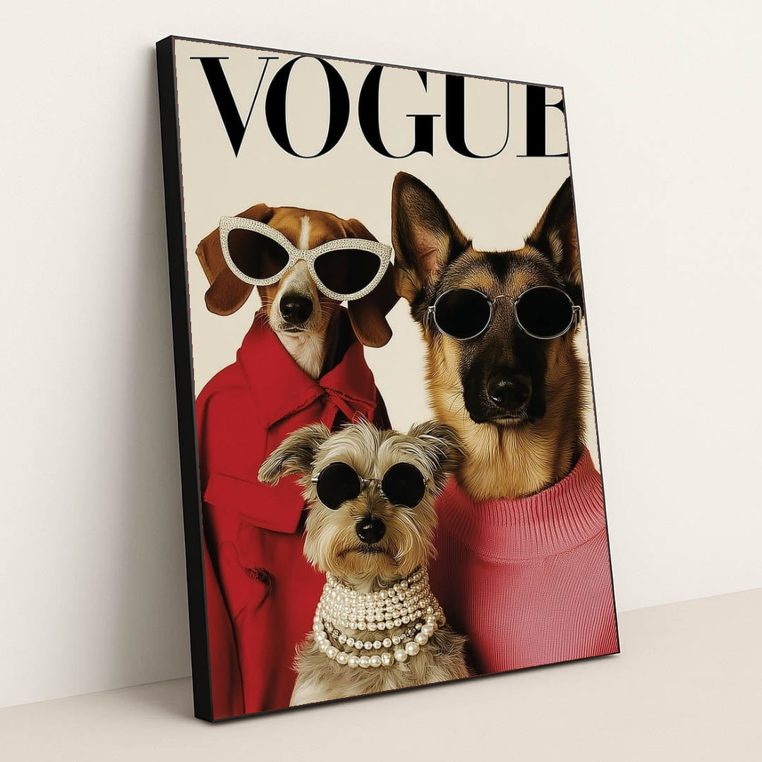This artwork shows three stylish dogs wearing sunglasses, coats, and pearls posing on a Vogue magazine cover, in a black frame.
