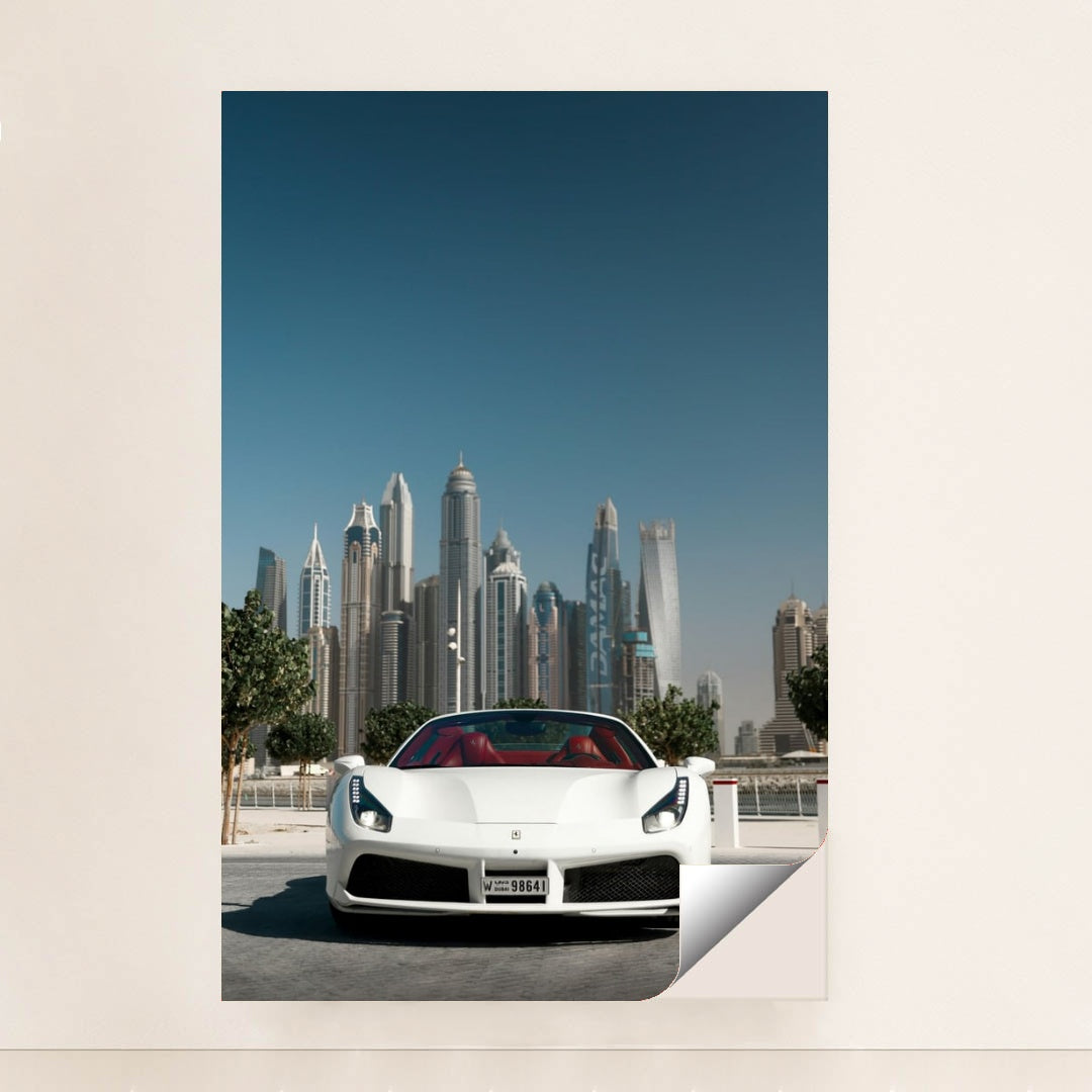 This photo shows a white Ferrari convertible with red seats parked in front of Dubai skyscrapers under a clear blue sky, minimalist unframed style.