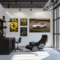 Modern office featuring wall art of a Vintage Porsche 911 SC Targa beside sleek black furniture and a stylish chair.