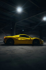 Ferrari 488 GTB in the Spotlight, vivid yellow coupe in industrial space with dramatic lighting, perfect for car wall art.