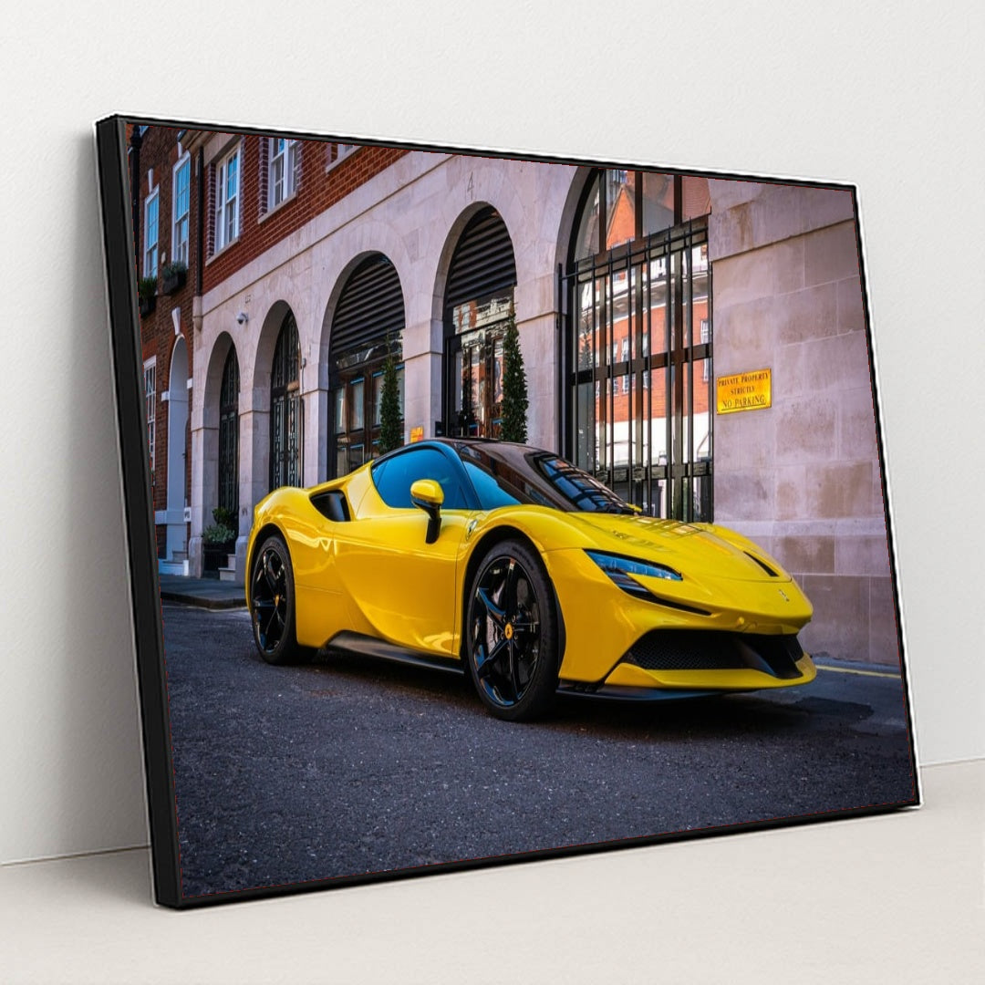 This photo shows a yellow Ferrari SF90 Stradale parked on the street in front of elegant city buildings, in a black frame.