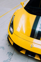 Close-up of Ferrari Racing in Yellow Stripes car wall art, highlighting sleek yellow finish and bold black racing stripes.
