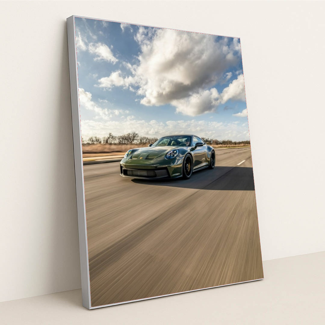Porsche 911 on Open Highway, deep green car wall art racing down a blurred highway under a dramatic sky.