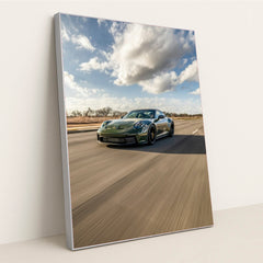 Porsche 911 on Open Highway, deep green car wall art racing down a blurred highway under a dramatic sky.