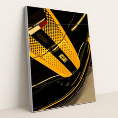 Ferrari Nose Detail close-up showcasing sleek black finish and yellow racing stripe, perfect for car wall art.