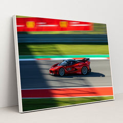 Ferrari FXX-K Evo Racing car wall art, a vivid red racing car in motion on the racetrack with a blurred background.