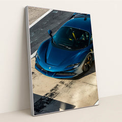 Ferrari SF90 Stradale in Pit Lane captured from above, showcasing its deep metallic blue body and sleek design as car wall art.