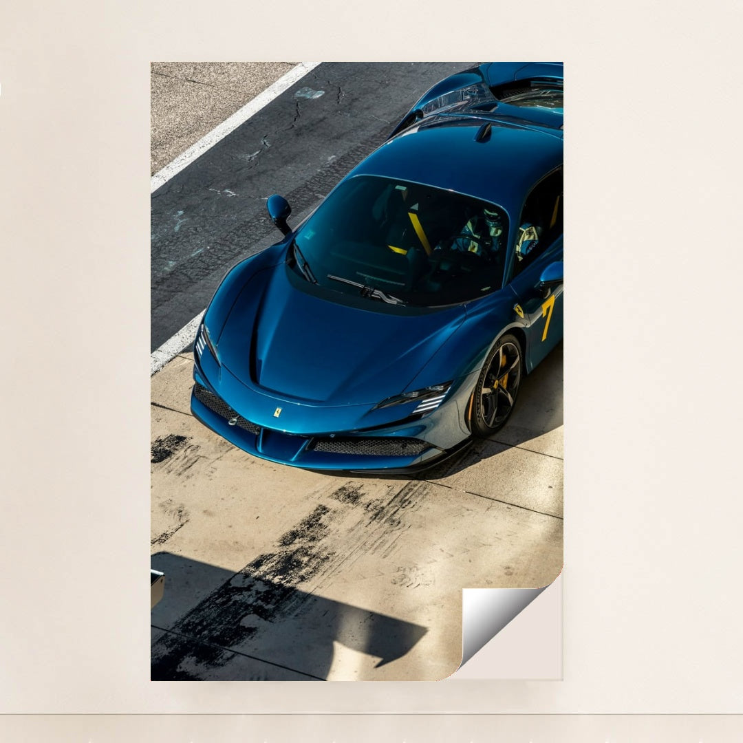 Ferrari SF90 Stradale in Pit Lane showcasing its deep blue body, sharp lines, and bold yellow '7' as car wall art.
