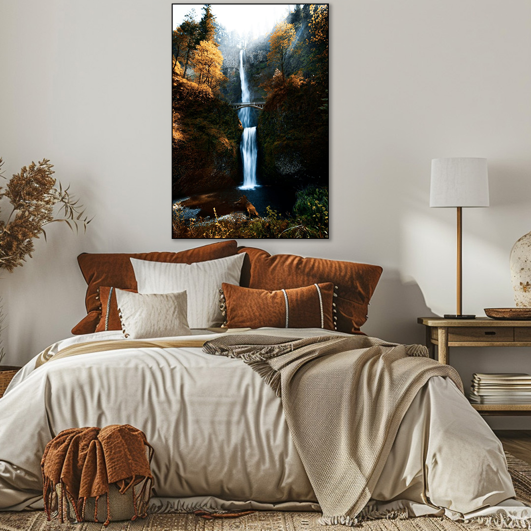 Bedroom with a large bed, decorative pillows, and a wall painting of a waterfall.
