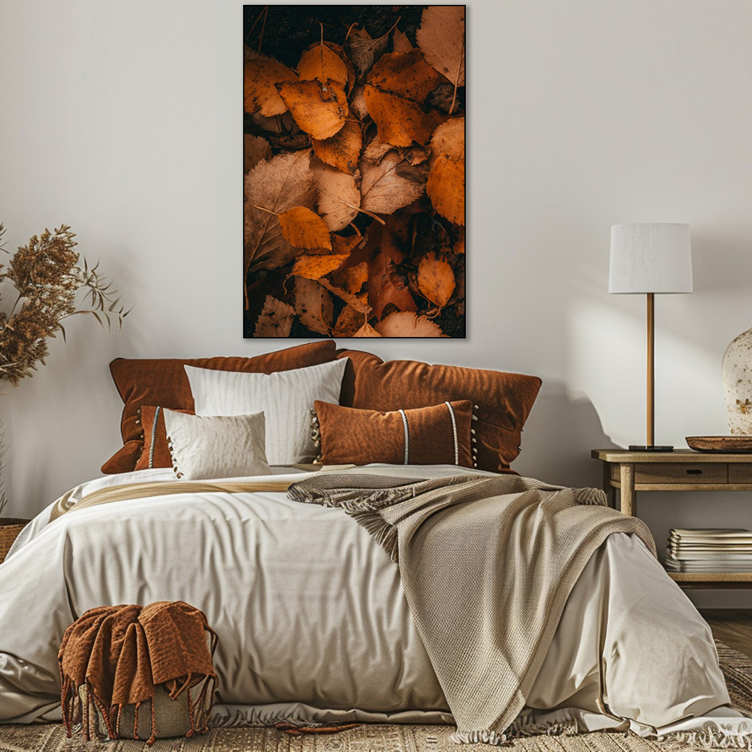 Cozy bedroom with a bed, decorative pillows, and a wall art piece.