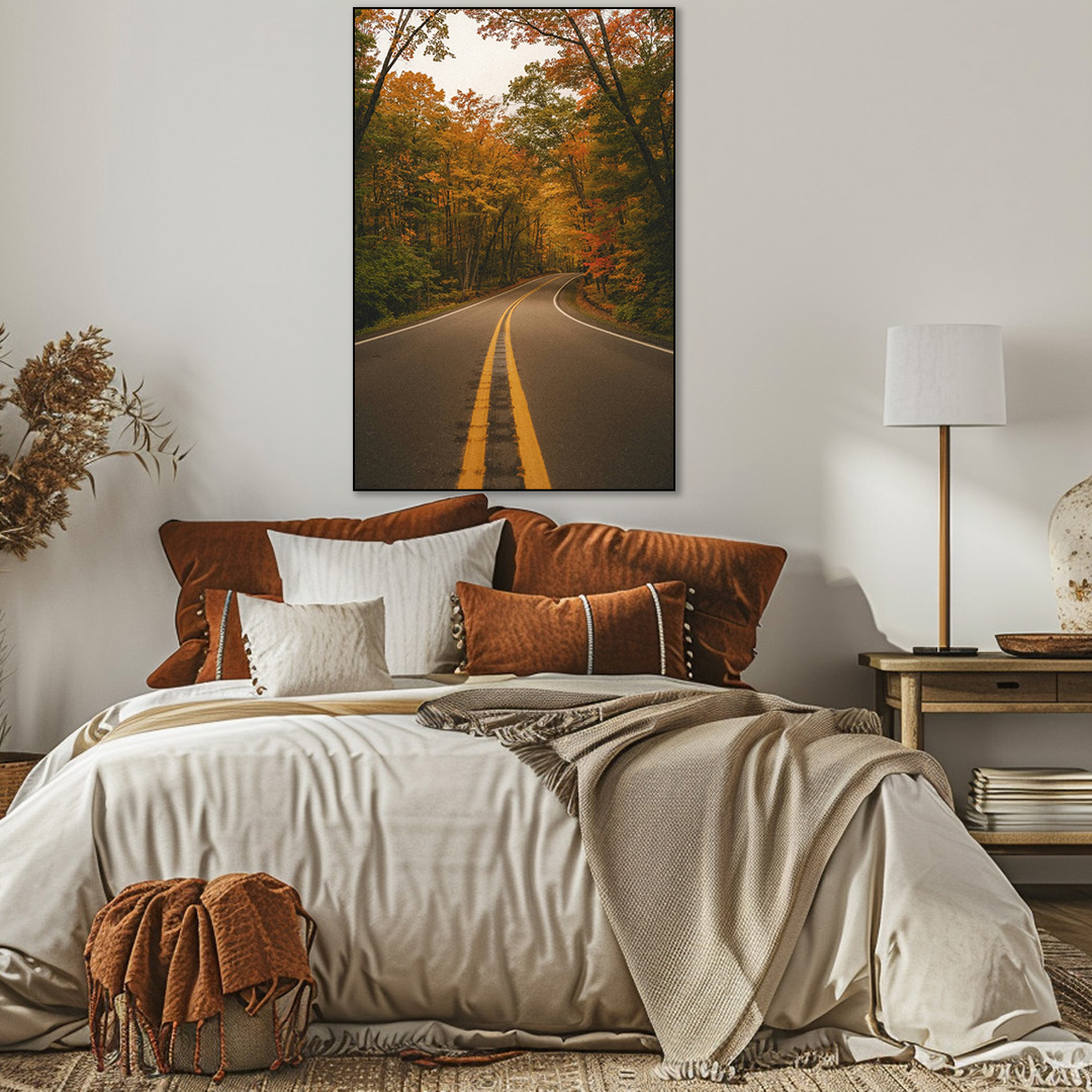 Cozy bedroom with a bed, pillows, and a wall painting of a road through trees.
