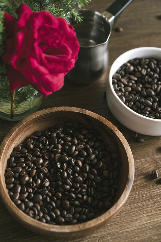 ArtHouse Studio - A charming still life of coffee beans and a red rose exuding a warm, rustic vibe.