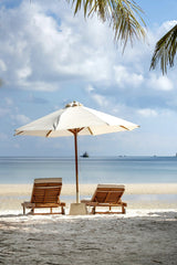 Quang Nguyen Vinh - Idyllic beach scene with chairs and umbrella, perfect for a serene vacation setting.