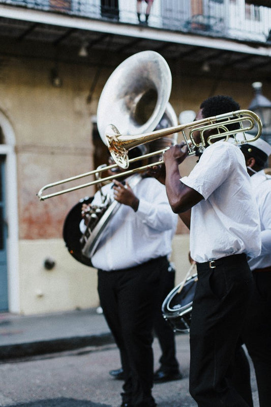 Kelly - Lively street musicians playing brass instruments in New Orleans.