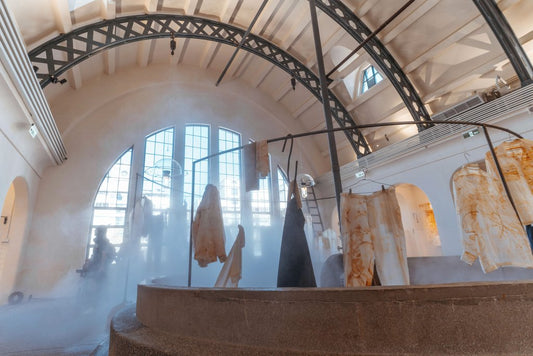Jimmy Liao - Modern industrial interior featuring an art installation with steam effect.