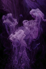 Engin Akyurt - Vibrant purple ink swirling in water against a dark background, creating an abstract and artistic effect.
