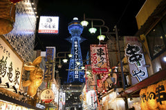 David Dibert - Colorful neon-lit street in bustling Osaka, showcasing vibrant urban nightlife.