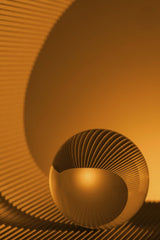 Skyler Ewing - An abstract art piece featuring an orange sphere with intricate textures and patterns.