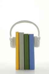 Sound On - A stack of colorful books with headphones, symbolizing audio learning on a white background.