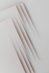 Edward Jenner - Minimalist abstract design featuring layered paper sheets creating geometric patterns.