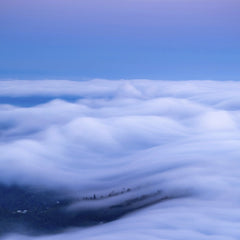 Zetong Li - An enchanting view of clouds resembling ocean waves during twilight.