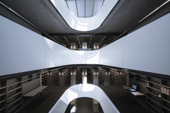 Marcus Lenk - A sleek and contemporary library interior, showcasing modern architectural design and ample natural lighting.