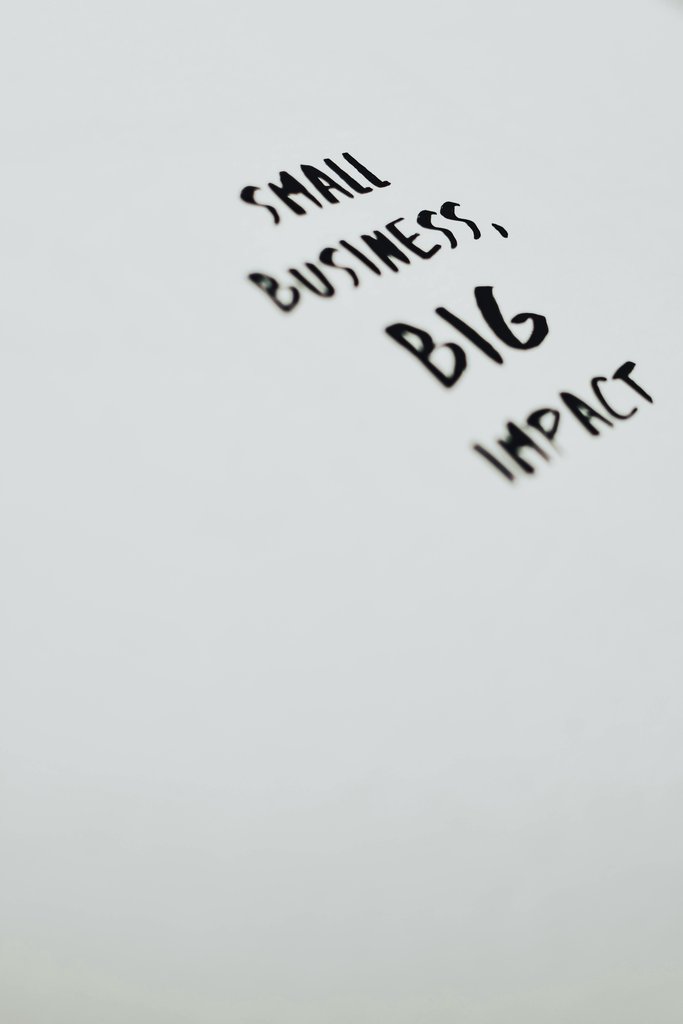 Eva Bronzini - A motivational quote highlighting the impact of small businesses on a minimalist background.