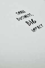 Eva Bronzini - A motivational quote highlighting the impact of small businesses on a minimalist background.