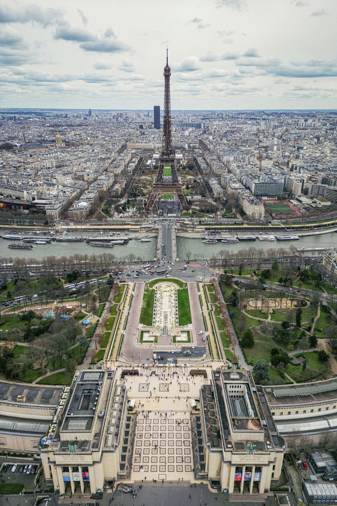 Fatih Turan - Breathtaking aerial view of the Eiffel Tower and Paris cityscape with visible landmarks and scenic details.