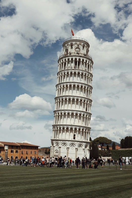Efrem  Efre - The renowned Leaning Tower of Pisa surrounded by tourists on a clear day, perfect for travel enthusiasts.