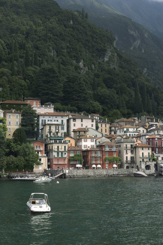Tetyana Kovyrina - Charming colorful houses along Lake Como, Italy's lush green hills.