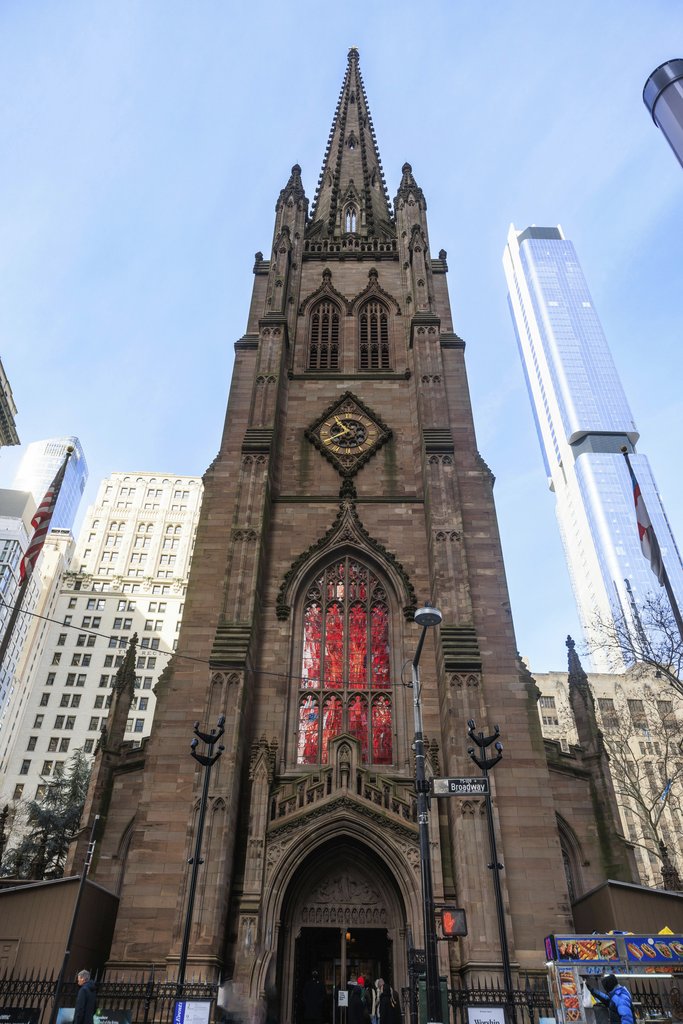 Phil Evenden - Front view of Trinity Church in NYC amidst skyscrapers