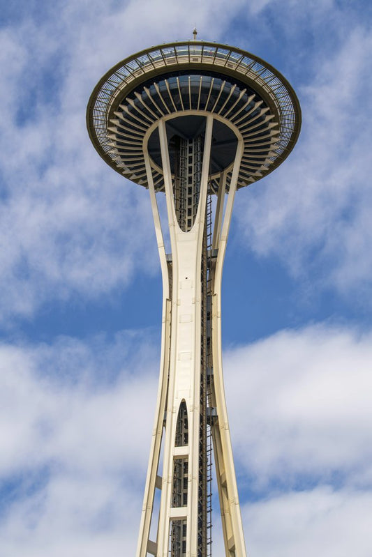ali saeed - Close-up view of the iconic Space Needle in Seattle against a blue sky.
