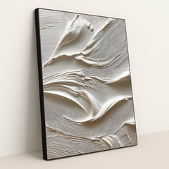 This artwork features thick, creamy white textured paint in sweeping abstract strokes, in a black frame.