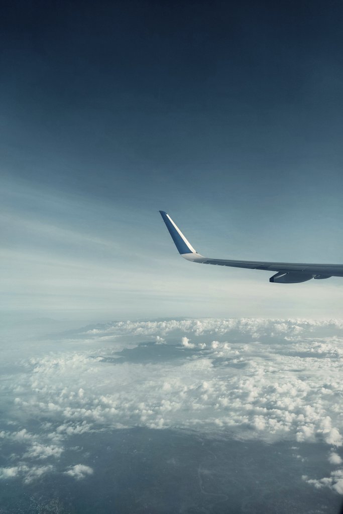 Gautham Reghu - Beautiful view of an airplane wing with fluffy clouds and blue sky from the window. Ideal for travel themes.